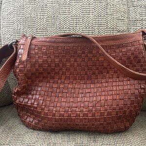 Leather women’s woven handbag.